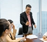 Business leader addressing a team, illustrating accountability meaning, ownership and team leadership responsibilities.
